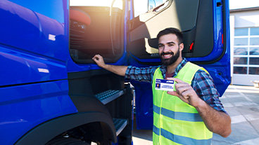 happy man holding up a license